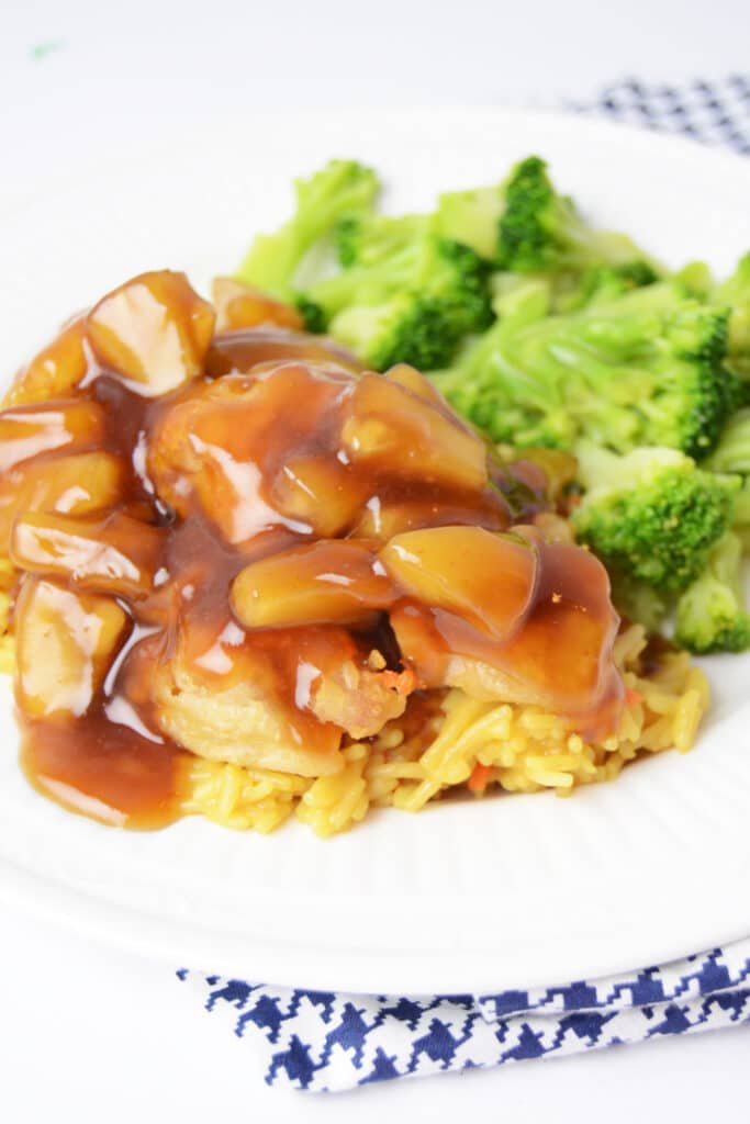 Sweet and sour chicken on plate with broccoli