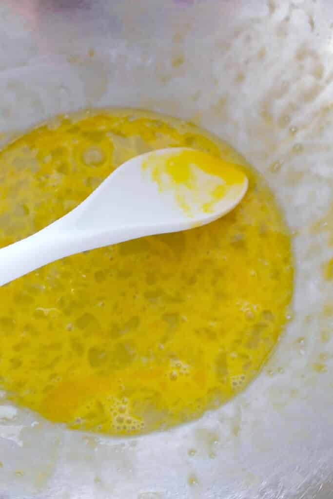 Whisked eggs in bowl