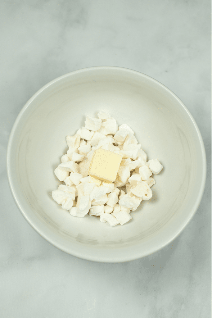 Adding butter and Marshmallows together in bowl