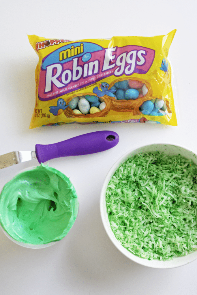 Adding green food coloring to coconut shreds