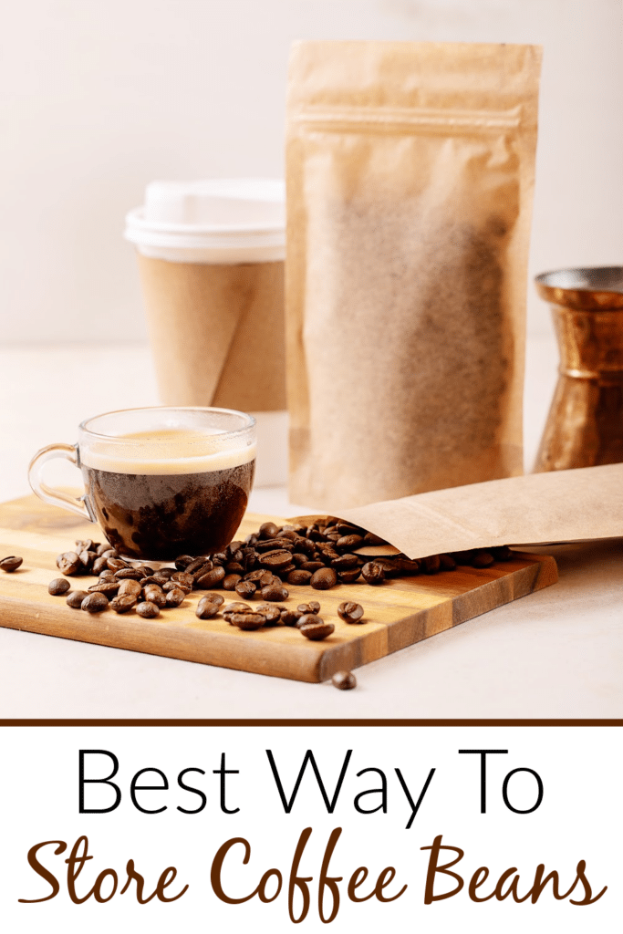 Best Way to store coffee beans - pictured a cup of black coffee with loose coffee beans on wooden cutting board