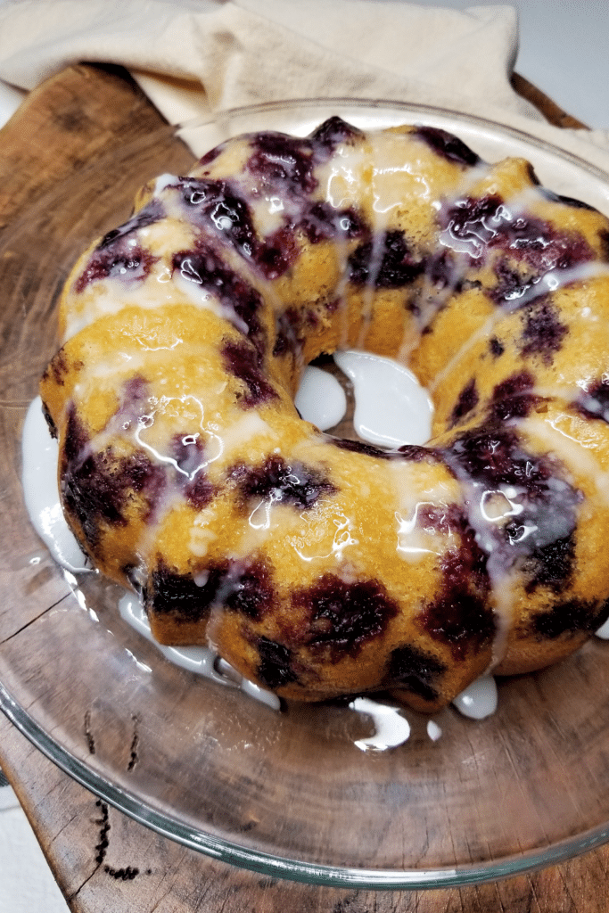 Blueberry sour cream pound cake on clear glass plate