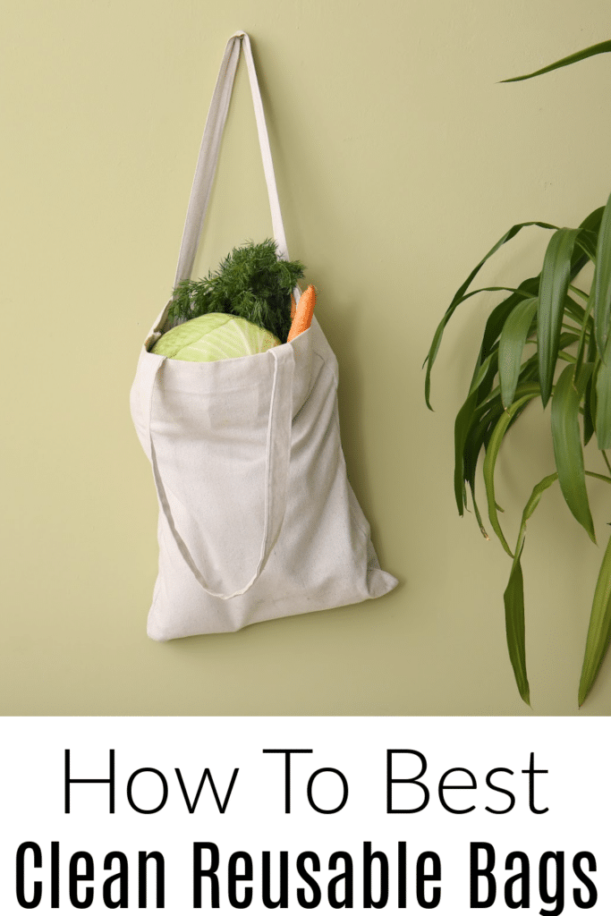 How to clean reusable bags - pictured cloth grocery bag hanging on hook