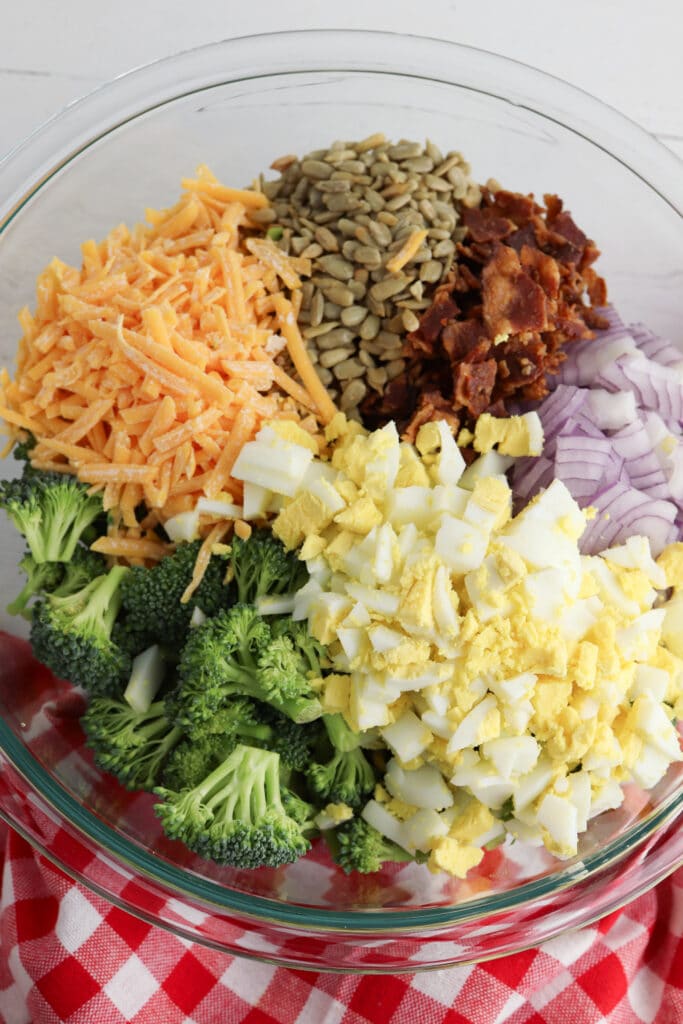 Mixing ingredients together in clear glass bowl