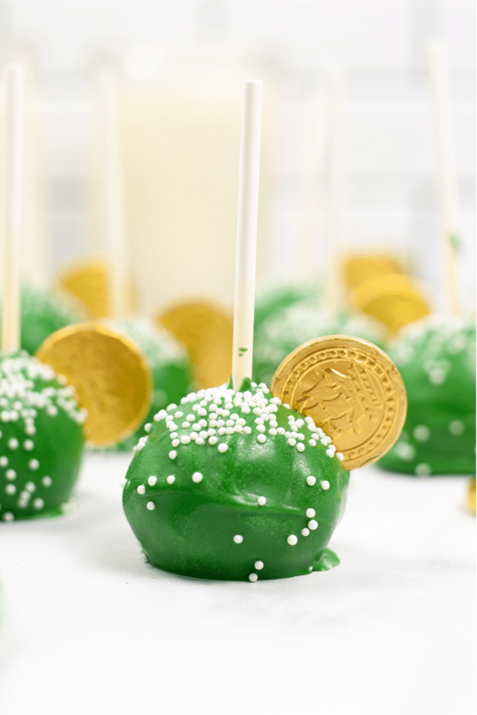 St. Patrick's Day cake pops finished on parchment paper