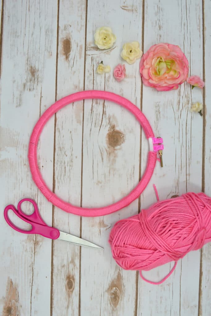 Wrapped hoop with pink yarn
