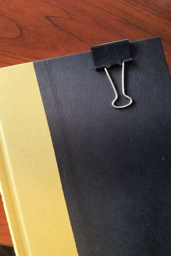 book marker using black metal binder clip