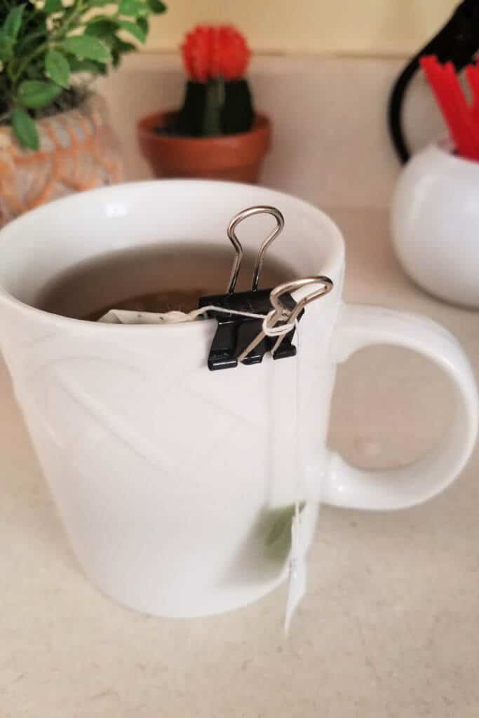 tea bag holder using a black metal binder clip