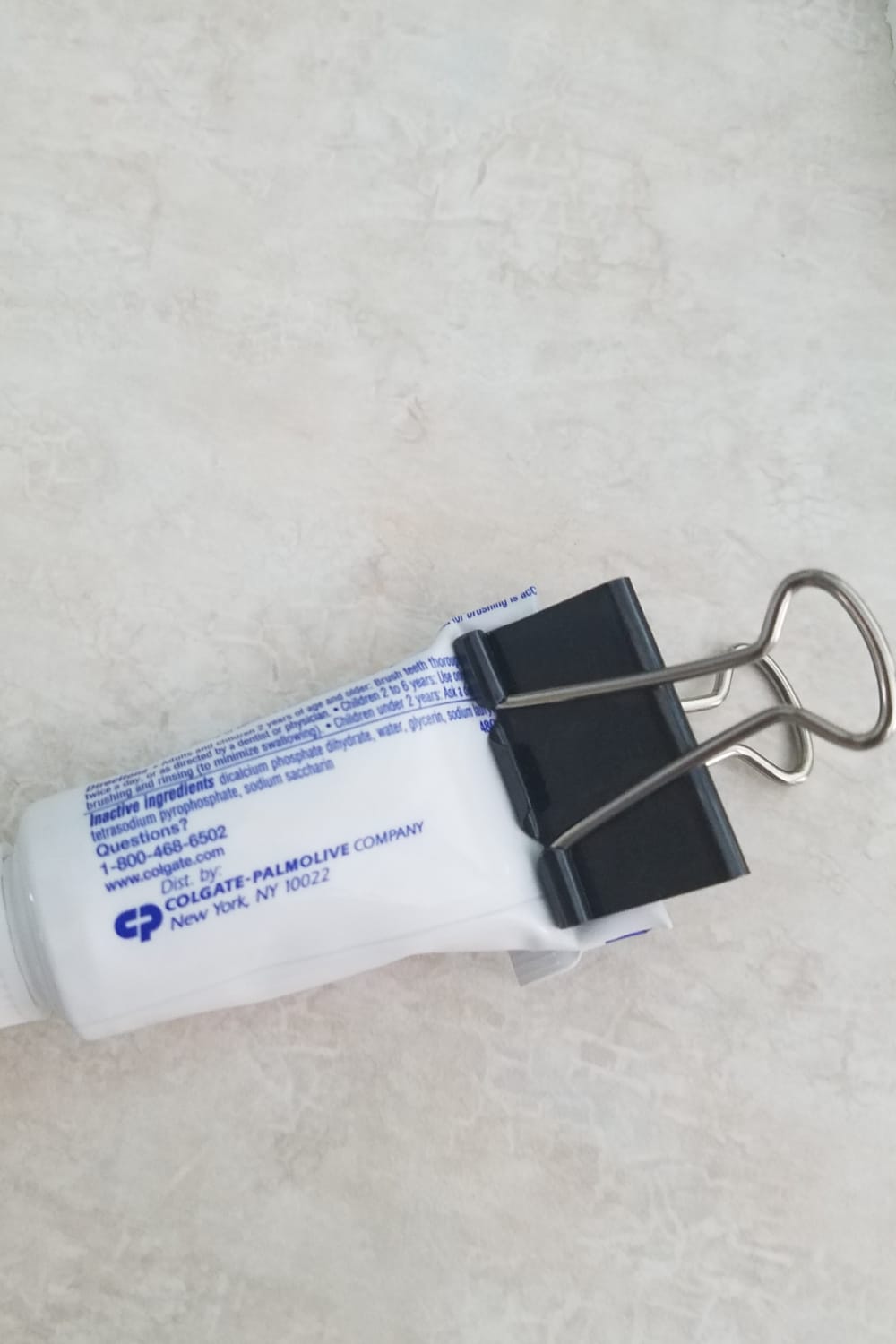 toothpaste holder binder clip