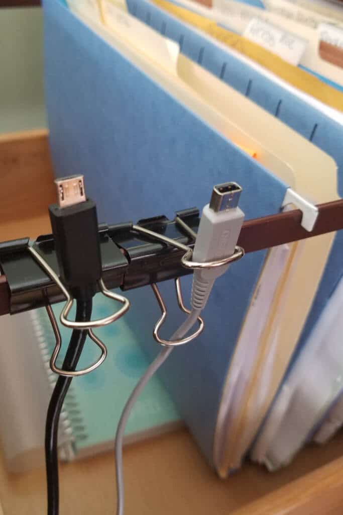 wire organizer using metal clips - pictured two phone cords being organied