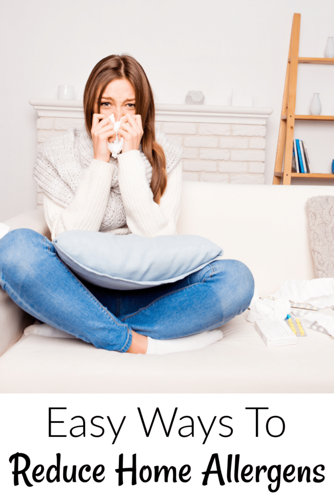 Easy Ways to Reduce Home Allergens  -woman sneezing on couch