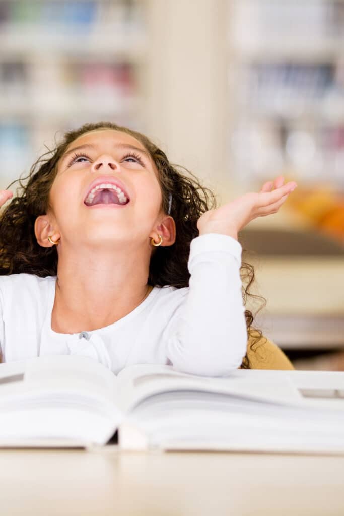 Little girl reading summer reading program