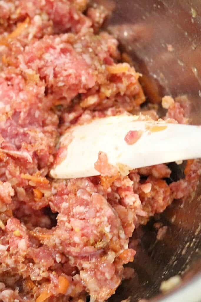 Mixing meat mixture ingredients in a bowl