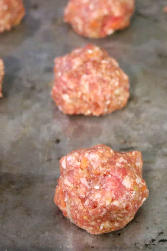 Rolling out ginger pork meatballs