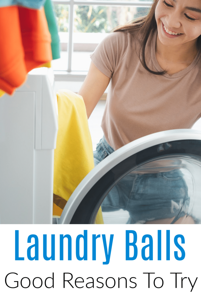 Why you should be using laundry balls - woman pulling clothes from dryer