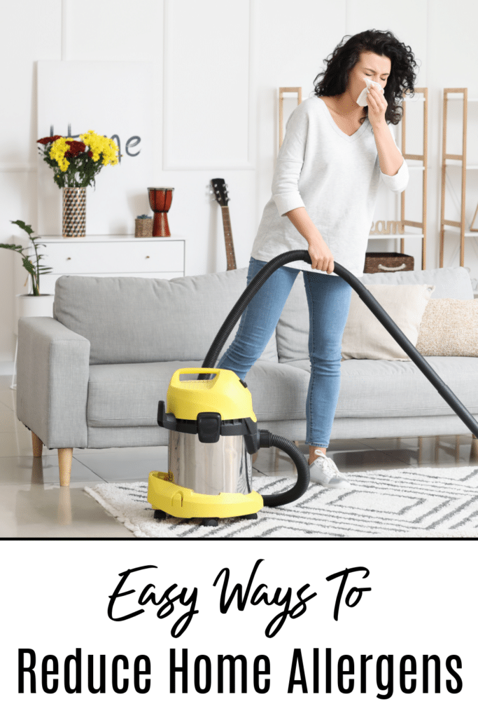 Women vacuuming home ways to reduce allergens in home
