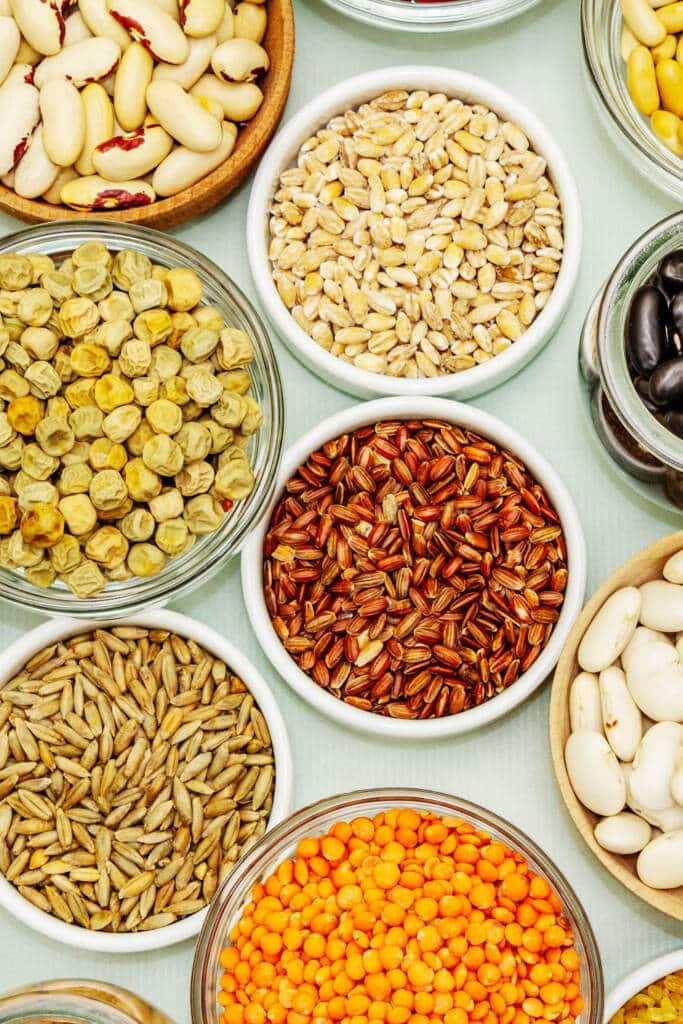 Bowls of beans and grains on table