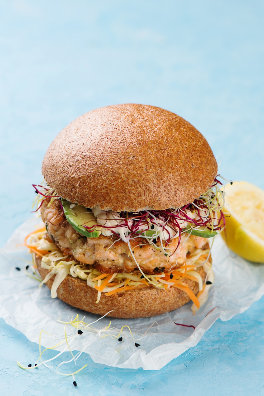 cooked salmon burger on bun