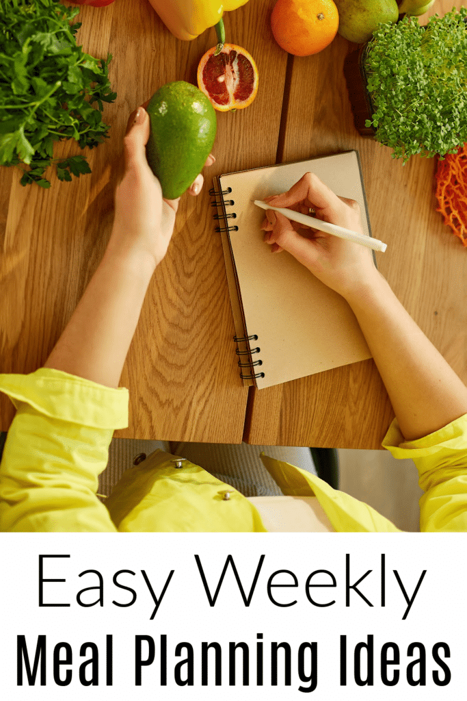 Easy Weekly Meal Planning ideas - woman at table going over shopping list. writing grocery list