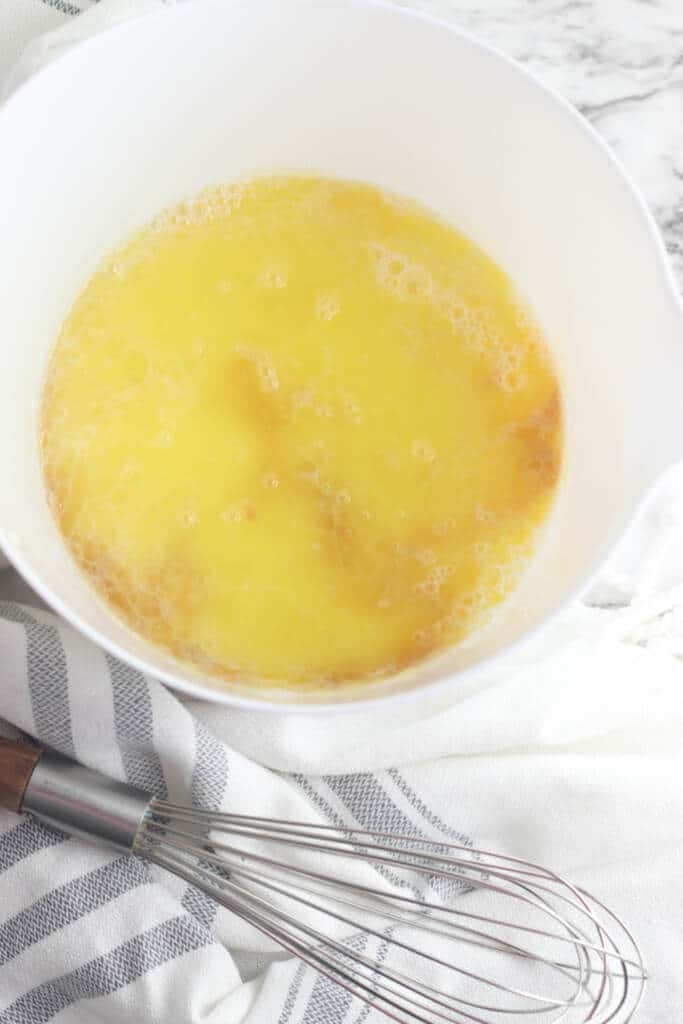 eggs and vanilla mixture in white mixing bowl
