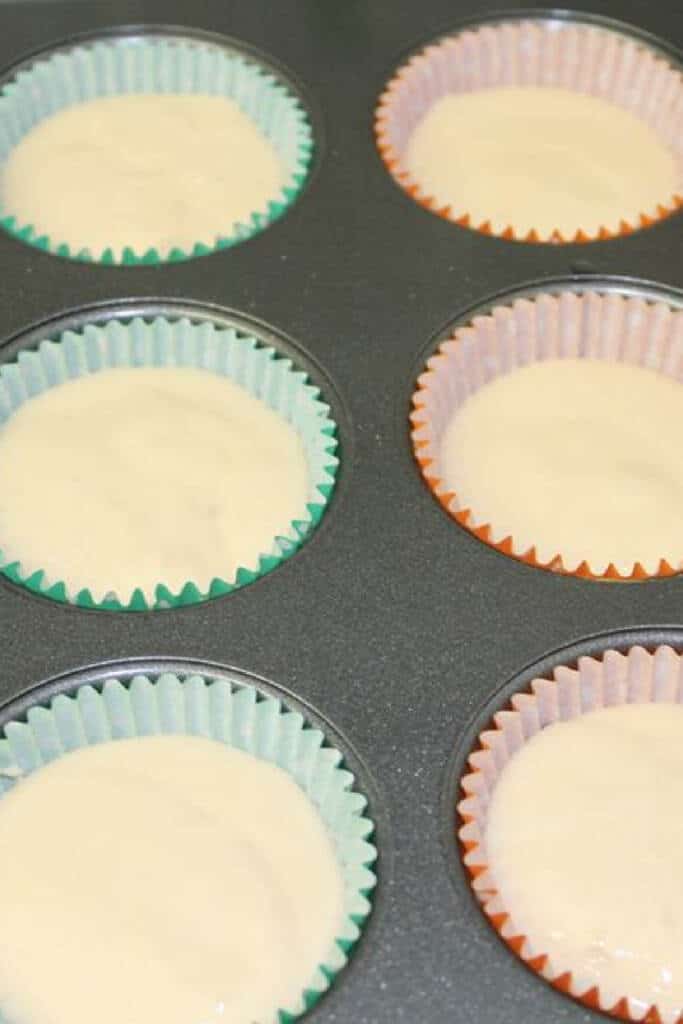 cupcake batter in cupcake pan with liners