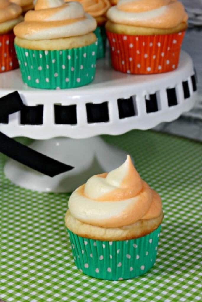 orange crush soda cupcakes on green background