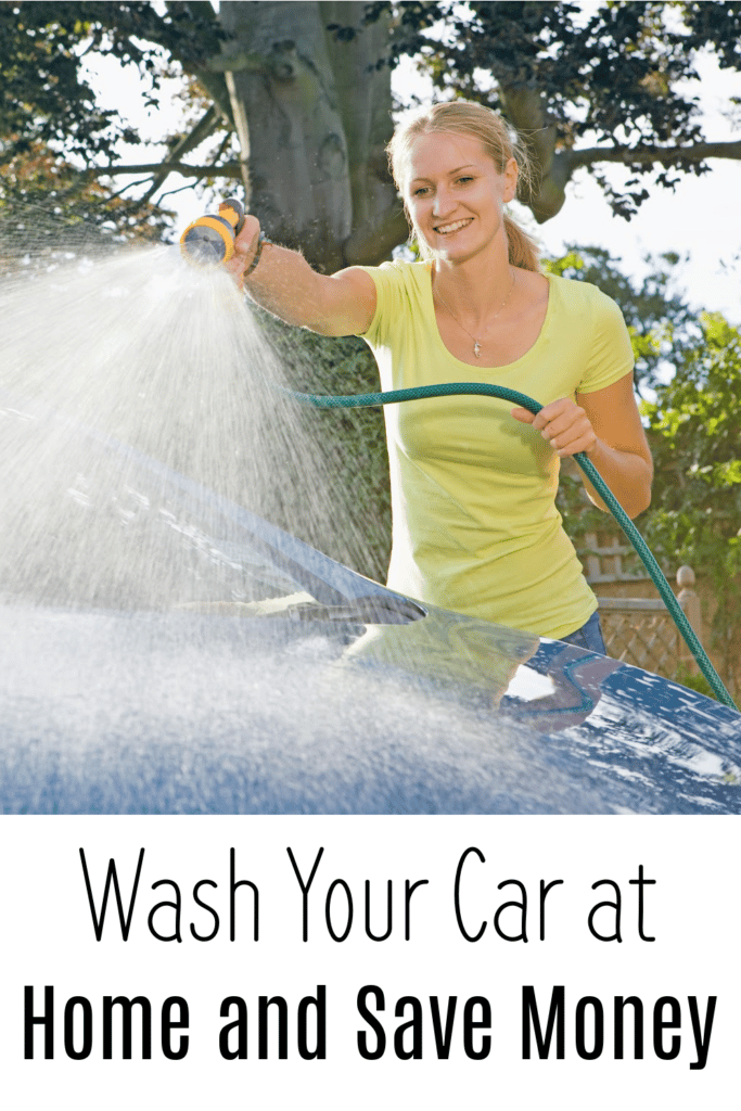 Wash your car at home and save money  - pictured woman washing car in driveway with hose