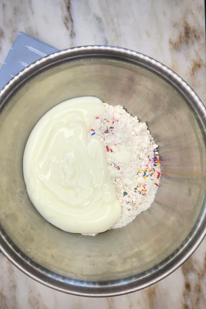 mixing yogurt and cake mix together