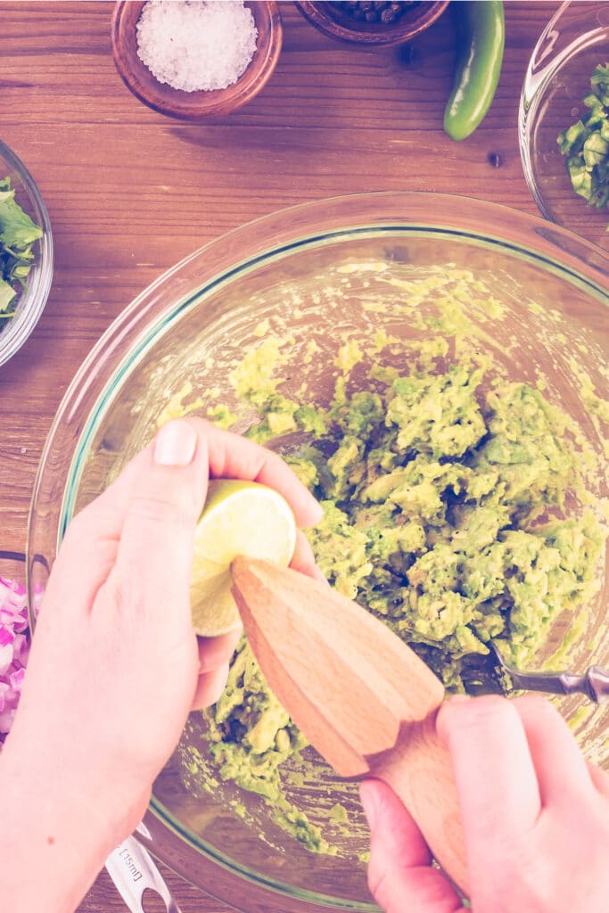 squeezing lime for guacamole