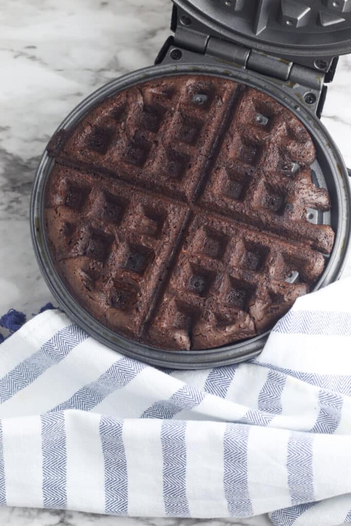 Cooked brownie waffle in waffle iron