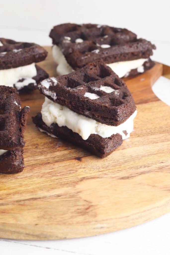 Ice cream brownie sandwiches on cutting board