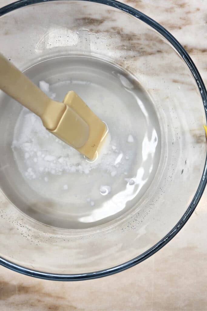 Mixing water and borax together to make slime activator