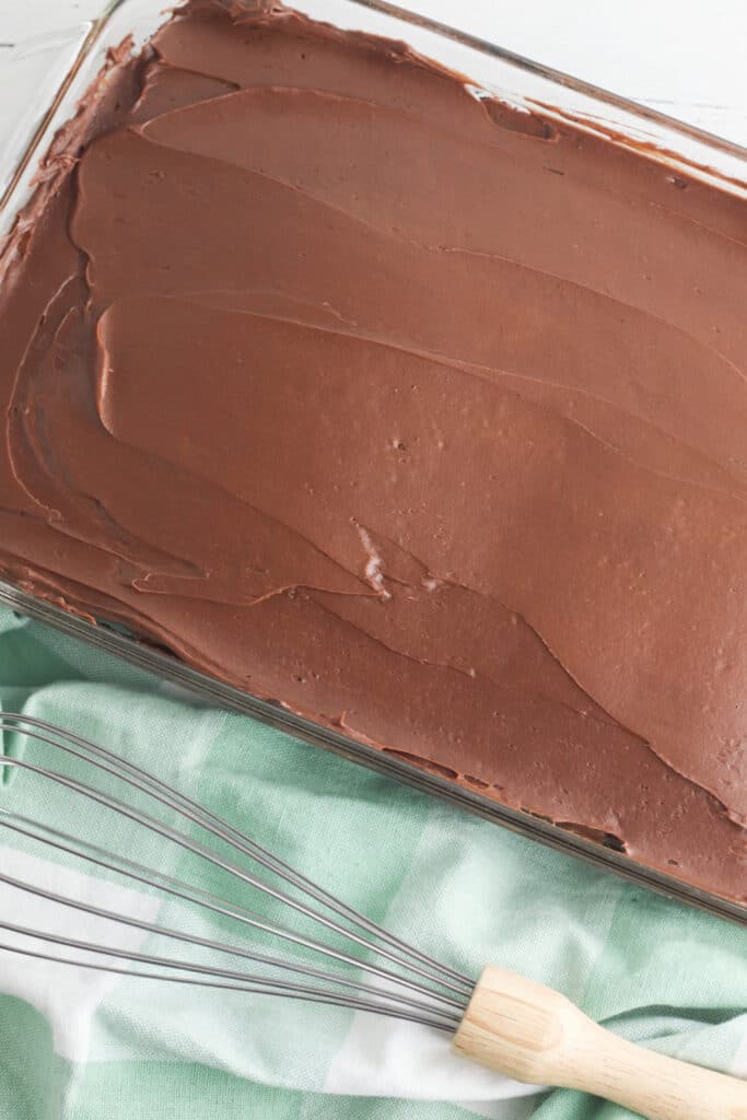 Finished frosted chocolate cake in casserole dish