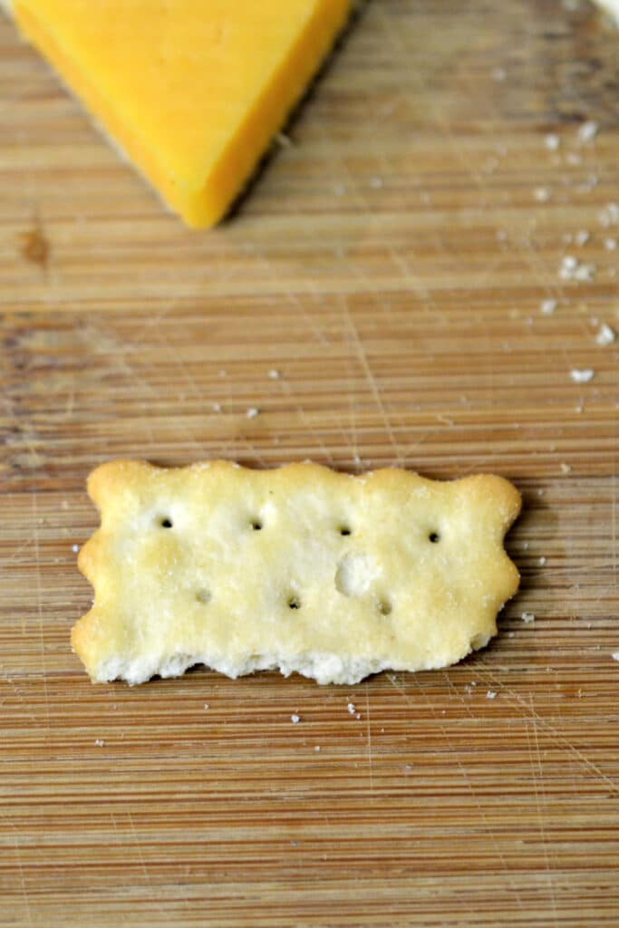 Half of chicken in a biscuit cracker. cut in half