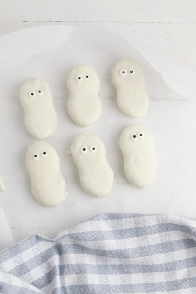 Transferring cookies to wax paper nutter butter halloween ghost cookies