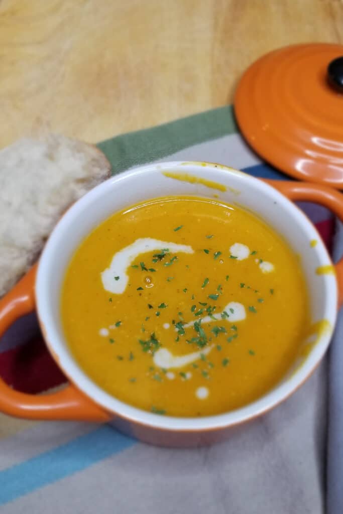 butternut squash soup in orange bowl - meal prep idea for busy moms