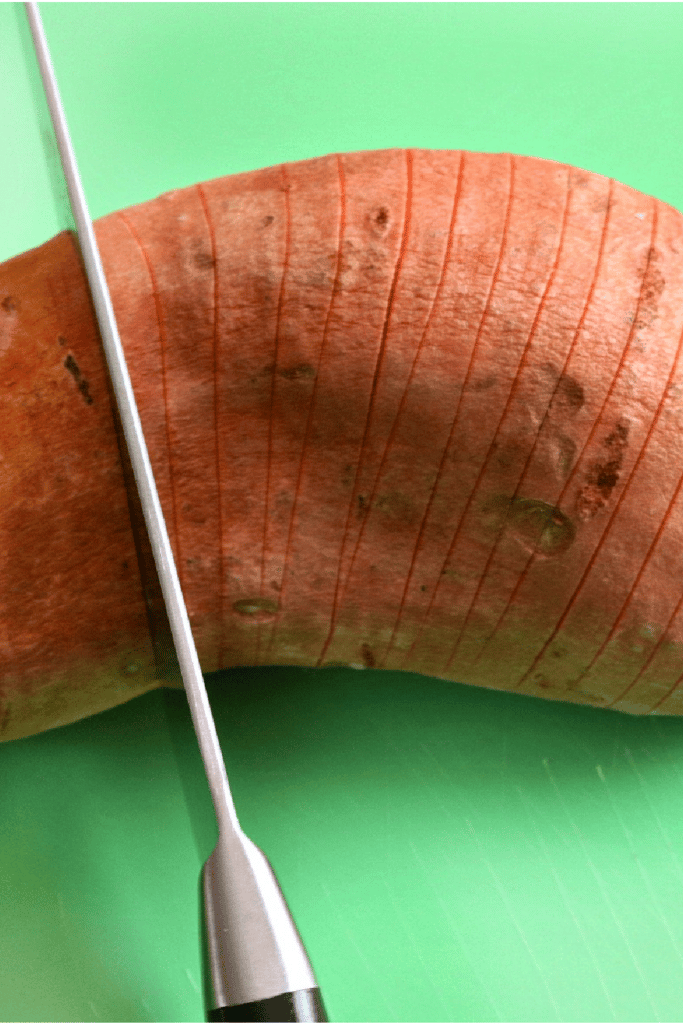 cutting sweet potato for hasselback