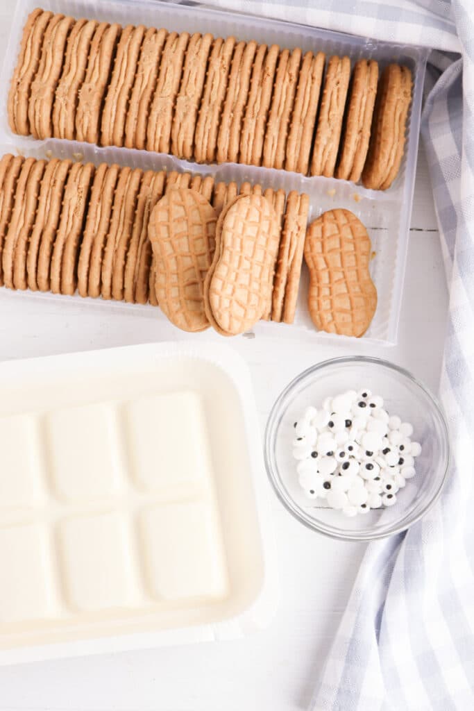 ingredients needed for Ghost Cookies on wooden white background