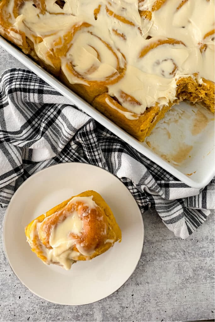 pumpkin spice cinnamon rolls on plate