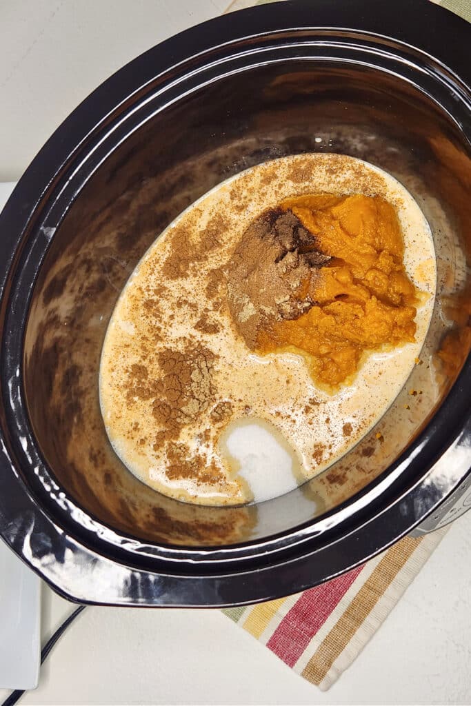 Adding pumpkin bread ingredients to crock pot