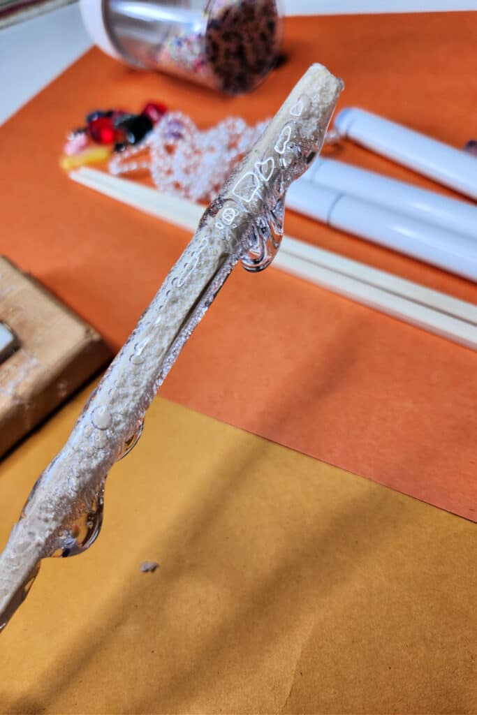 Making handle using hot glue on chop stick