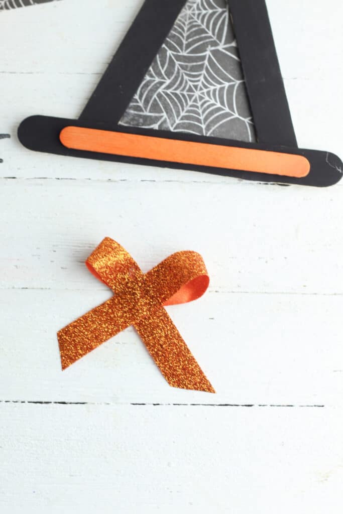 adding bow to witch hat - using orange ribbon