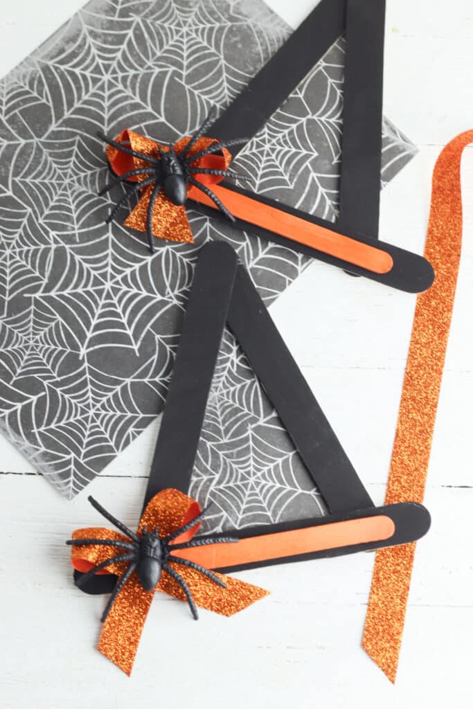 finish by adding embellishments - adding ribbon and black plastic spider