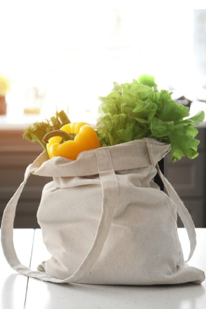 groceries on the counter in reusable grocery bag