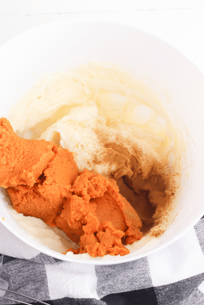 mixing ingredients together for pumpkin cheesecake dip