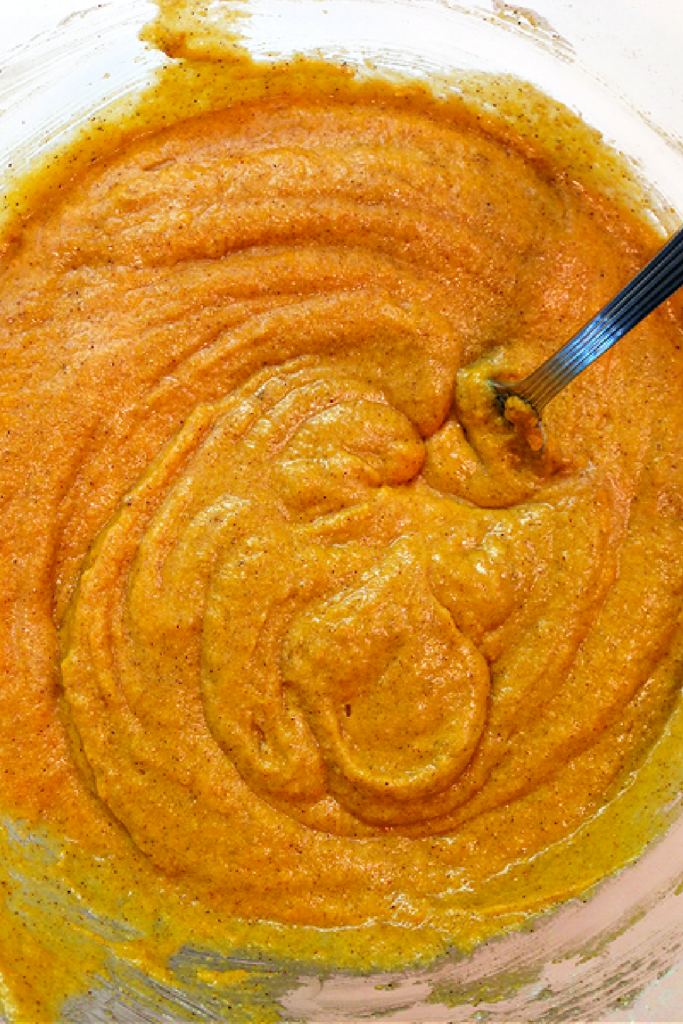 mixing wet ingredients together for pumpkin spiced doughnut