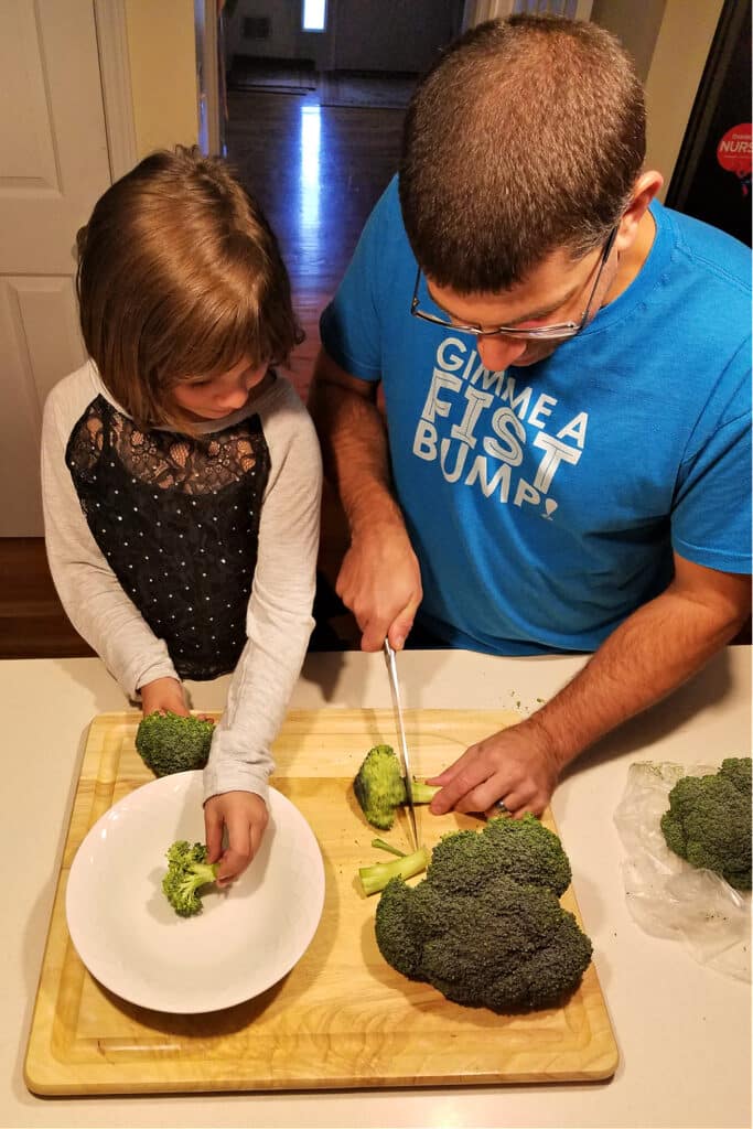 Emily and Matt cutting broccoli