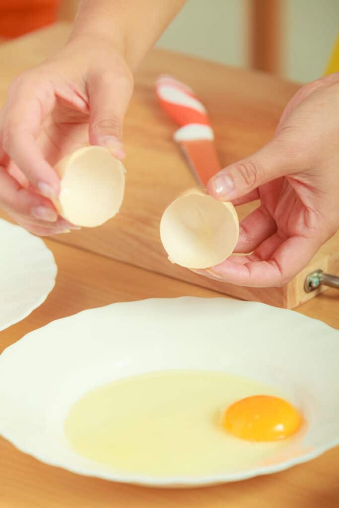 Raw eggs in bowl without shell