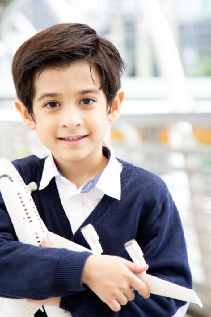 boy holding airplane