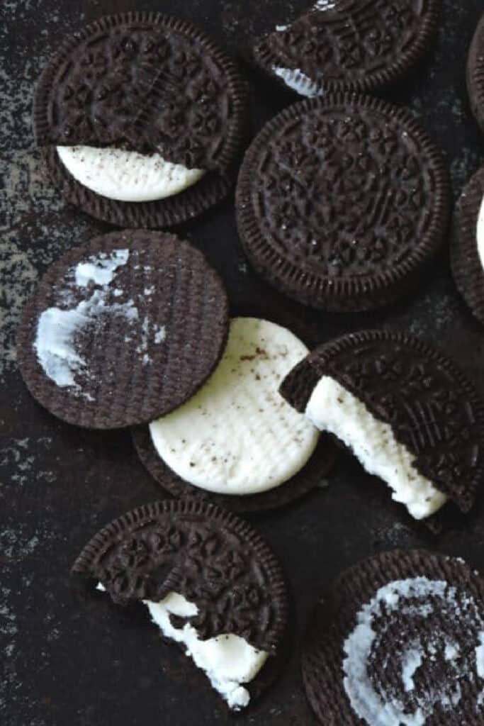 oreo cookies split apart on black background